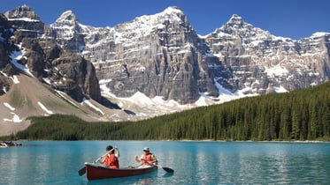two people in a canoe on Moraine Lake, Alberta - Cover for blog 